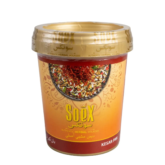 A pack of Soex Herbal Molasses in Kesar Paan flavor, with a gold and red color scheme and an image of the product visible through the transparent lid.