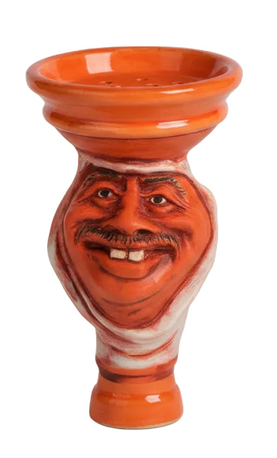 Red ceramic vase with face design on a white background, featuring the brand 'Zanobia'.