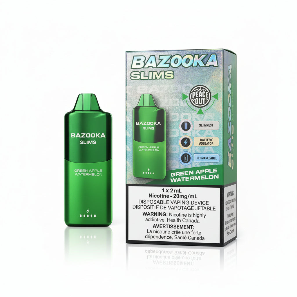A green disposable vaping device labeled 'BAZOOKA SLIMS GREEN APPLE WATERMELON' stands beside its colorful retail box on a white surface. The box has holographic 'BAZOOKA' lettering and product details including a nicotine strength warning panel.