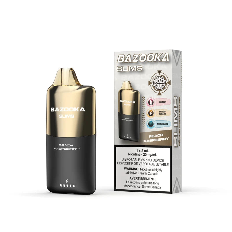 A Bazooka Slims disposable vaping device in Peach Raspberry flavor stands next to its retail packaging box on a clean white background. The device features a metallic gold top and a black bottom with white text.