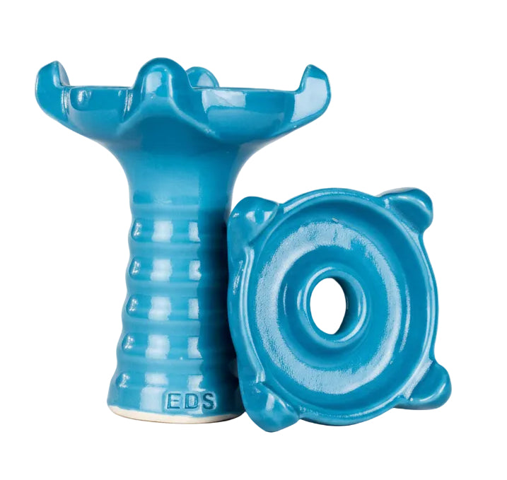 Blue ceramic vase with a unique design on a white background