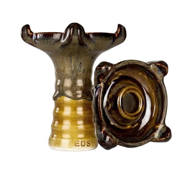 Decorative ceramic vase with a textured surface on a white background