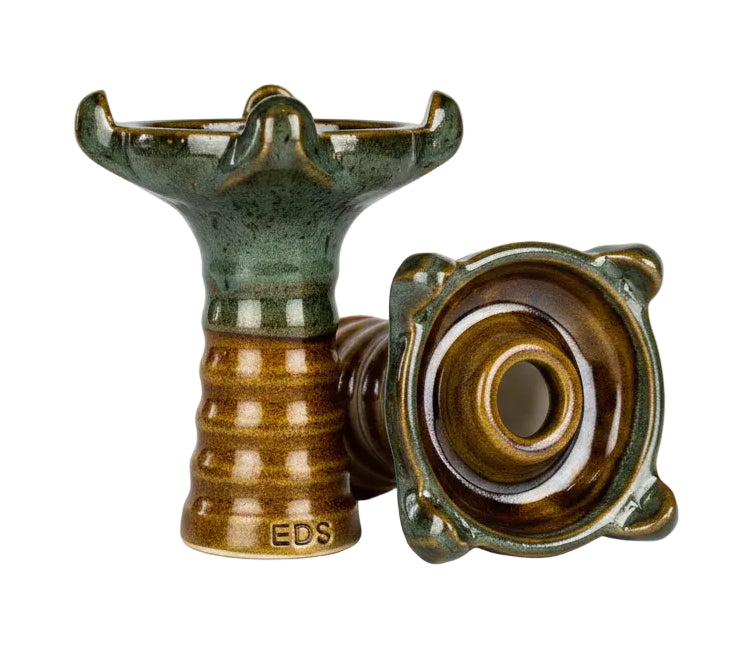 Decorative ceramic item with a textured surface on a white background