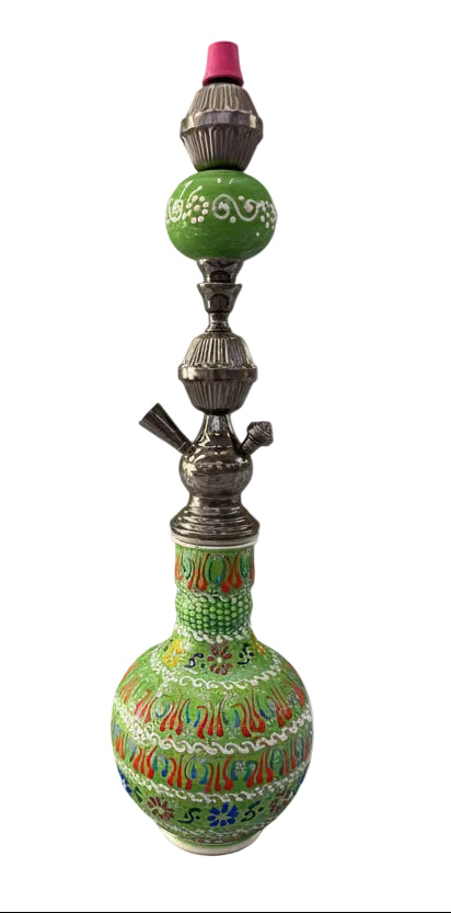 Decorative hookah with intricate designs on a white background