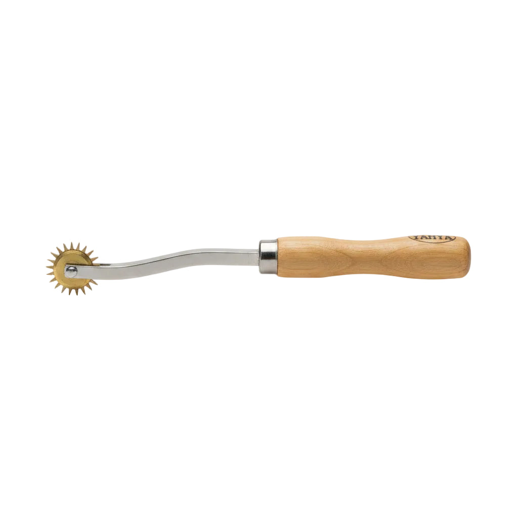 A curved metal pastry wheel with a light brown wooden handle, shown against a plain white background.